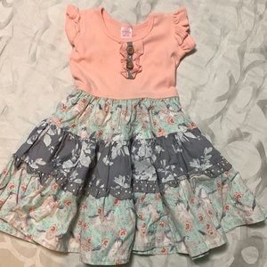 Girls dress with peach top and ruffle carousel horses on the skirting